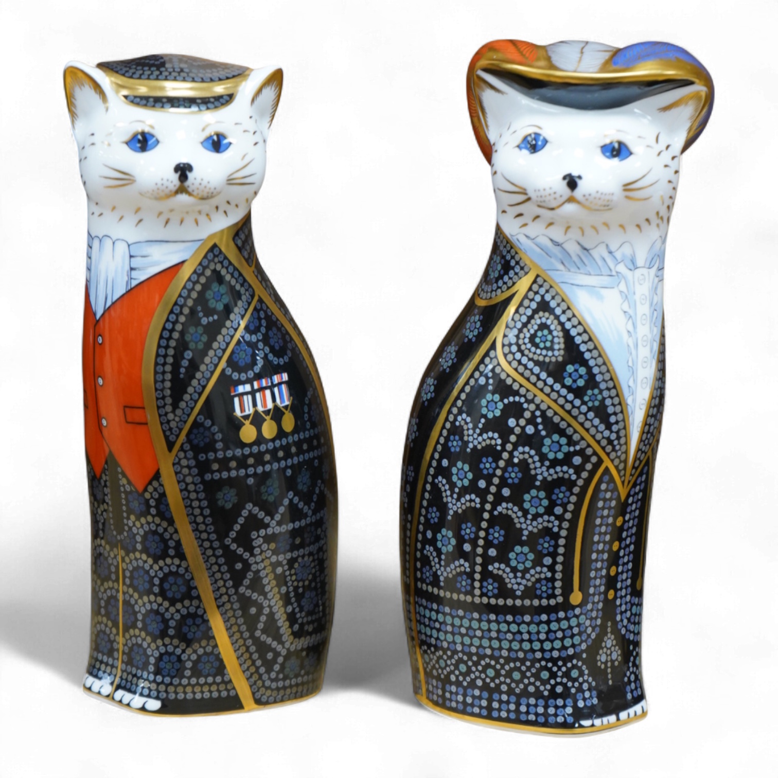 Two Royal Crown Derby cats compromising Pearly Queen and King, one with stopper, largest 20cm high